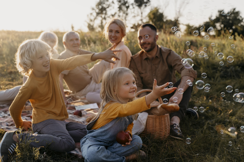 full-shot-happy-family-outdoors small